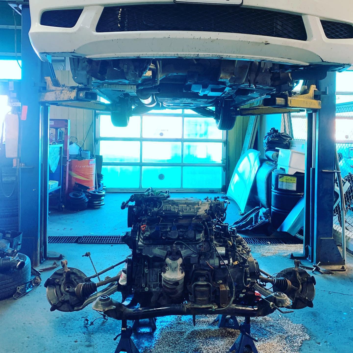 Vehicle on a lift during an engine installation