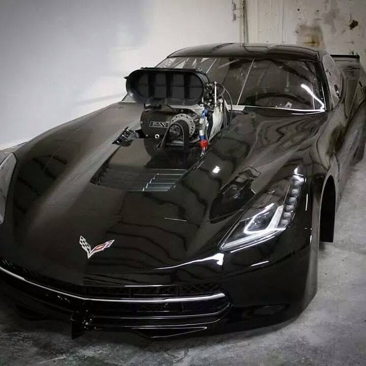 Black Corvette with supercharger through the hood